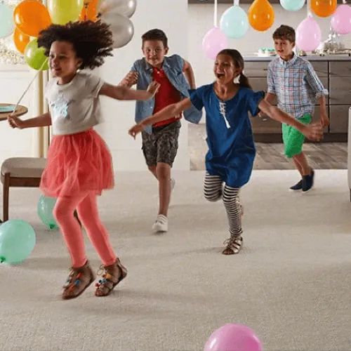 Kids enjoying with balloons | Flooring By Design