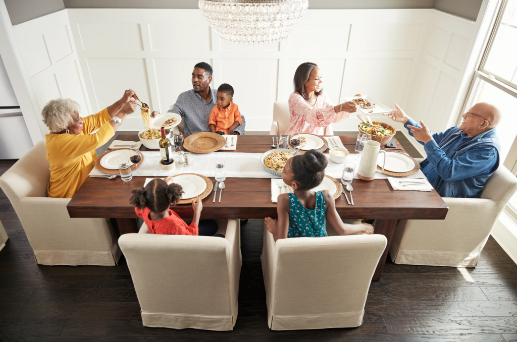 Family having breakfast at the dining table | Flooring By Design