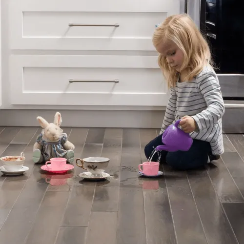 10_floorte_lifestyle Kid playing with toys | Flooring By Design