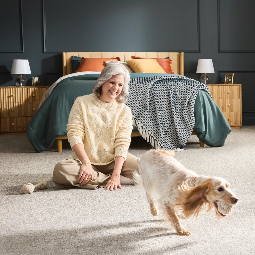 PetPerfect-Carpet-Img03@2x Lady playing with pet | Flooring By Design