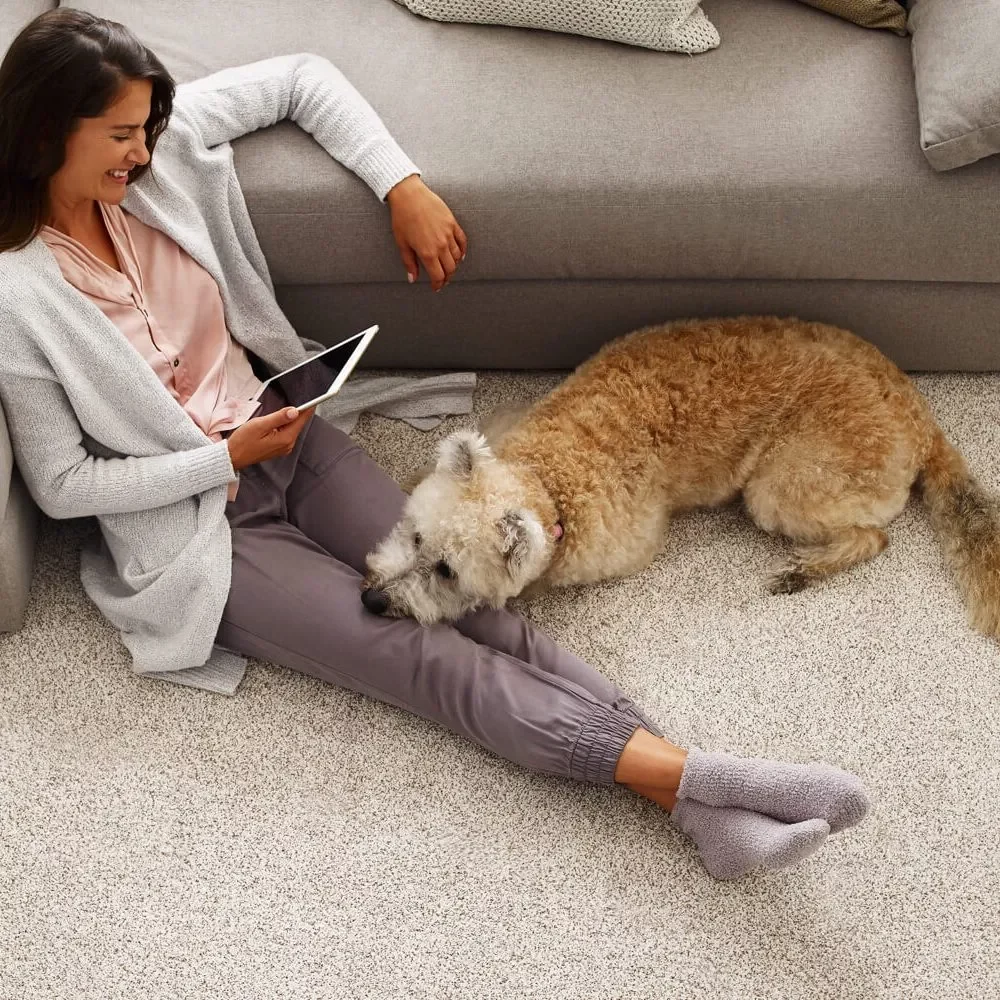 Smiling Lady with pet | Flooring By Design